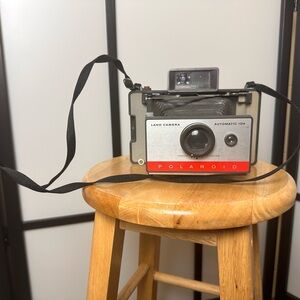 Vintage Polaroid Automatic 104 Camera with Red and Black Accents